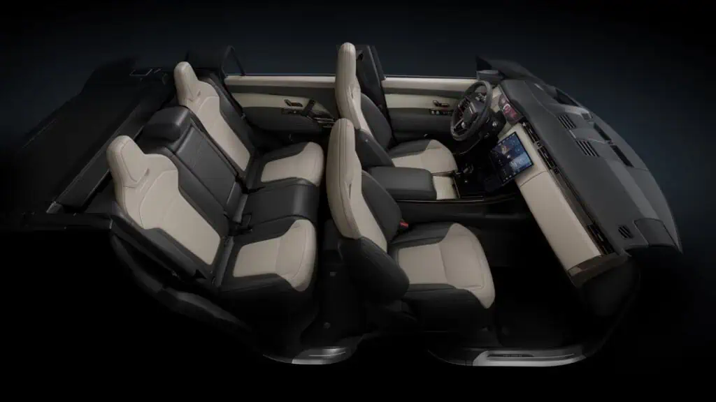 Luxury Land Rover interior with beige and black seats, advanced dashboard, and modern technology features.