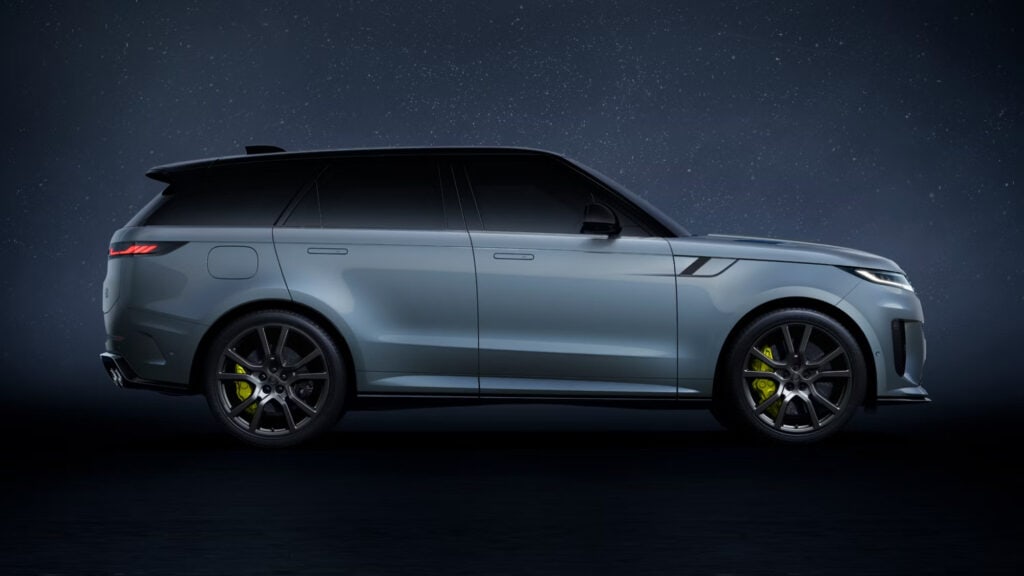 Sleek Land Rover SUV at night under a starry sky, showcasing luxury and advanced design.